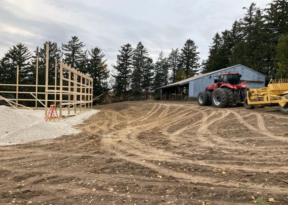 tractor leveling dirt on new construction